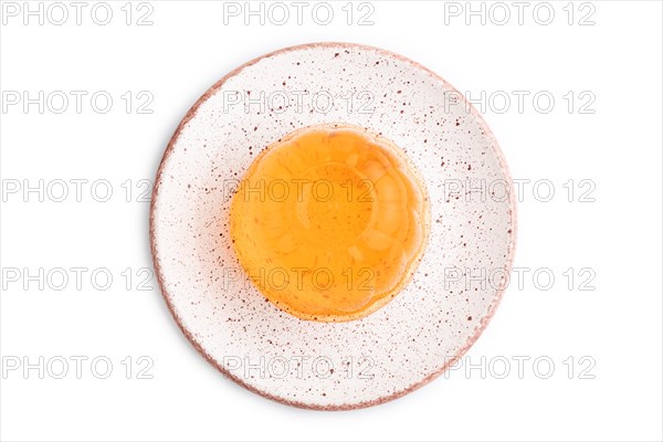 Apricot orange jelly isolated on white background. top view, flat lay, close up