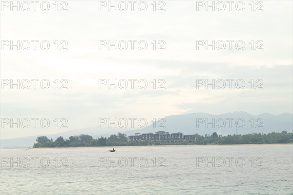 Lombok and Gili Air islands, overcast, cloudy day, sky and sea. Vacation, travel, tropics concept, no people. Sunny day, sand beach