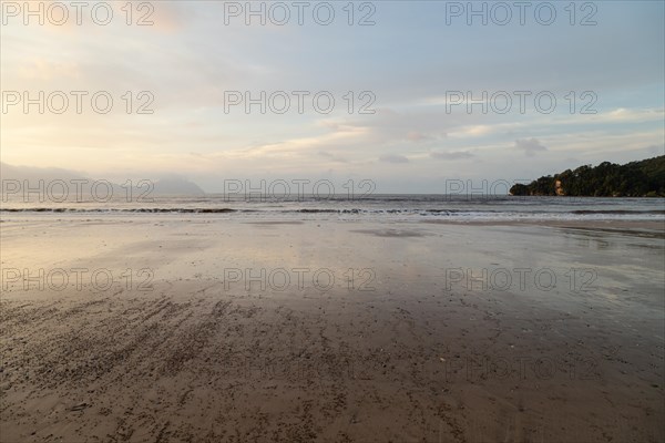 Bako national park, sea sandy beach, overcast, cloudy sunset, sky and sea, low tide. Vacation, travel, tropics concept, no people, Malaysia, Kuching, Asia