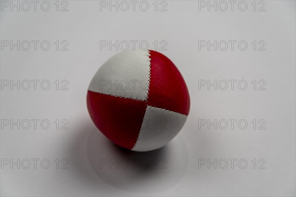 Juggling ball in front of a white background, studio shot, Germany, Europe