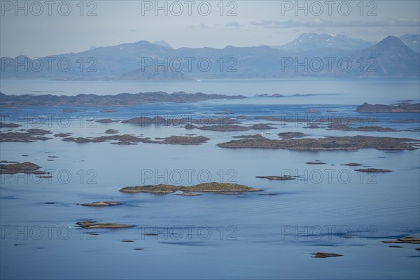 View of the sea with archipelago islands from Svellingsflaket and mountains, from Dronningsvarden or Stortinden, Vesteralen, Norway, Europe