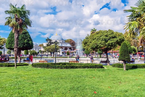 Landscape of fountain in Sultanahmet plaza with Hagia Sophia mosque in background in Istanbul, Turkiye