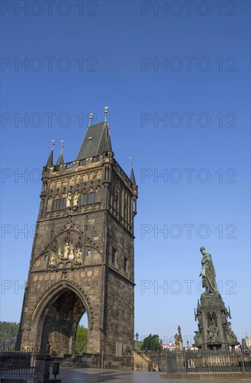 Bronze statue of King Charles IV at Krizovnicke Square, near Charles Bridge in Prague, Czech Republic, in sunny day, Europe