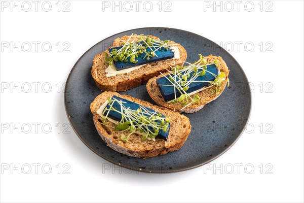 Bread sandwiches with blue lavender cheese and mustard microgreen isolated on white background. top view, flat lay, close up
