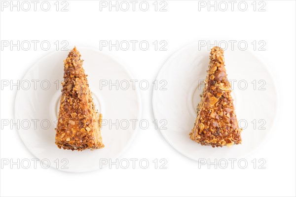 Walnut and hazelnut cake with caramel cream isolated on white background. top view, flat lay