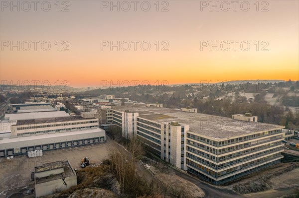 Aerial view of old Bader industrial buildings at sunset with warm colours, Pforzheim, Germany, Europe