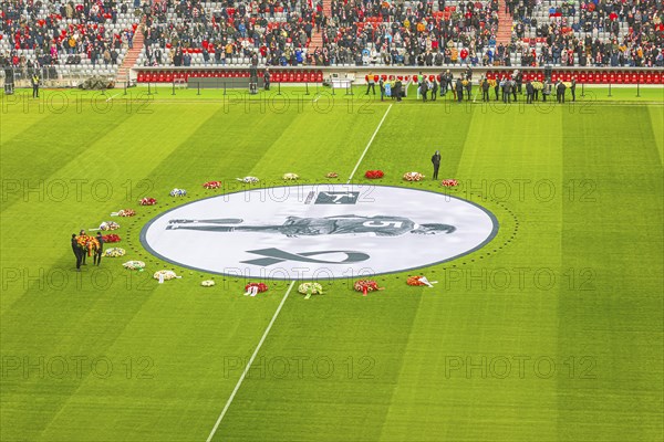 More floral wreaths are brought to the banner, banner with Franz Beckenbauer and floral wreaths, FC Bayern Munich funeral service for Franz Beckenbauer, Allianz Arena, Froettmaning, Munich, Upper Bavaria, Bavaria