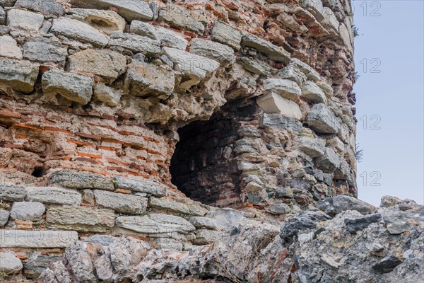 Closeup of hole in side of ancient castle tower ruins in Turkey