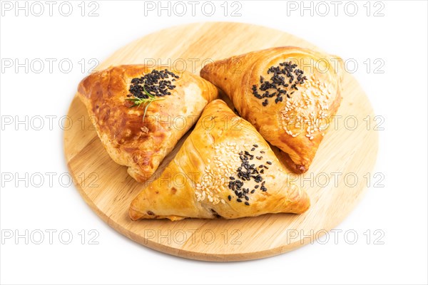 Homemade asian pastry samosa isolated on white background. side view, close up