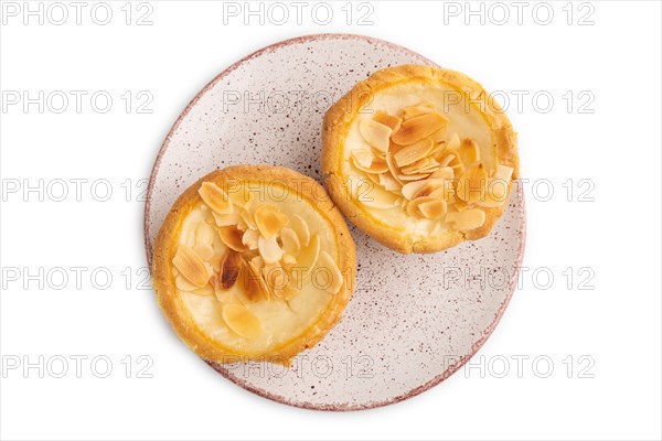 Traditional portuguese cakes pasteis de nata, custard small pies with almonds isolated on white background. Top view, flat lay, close up