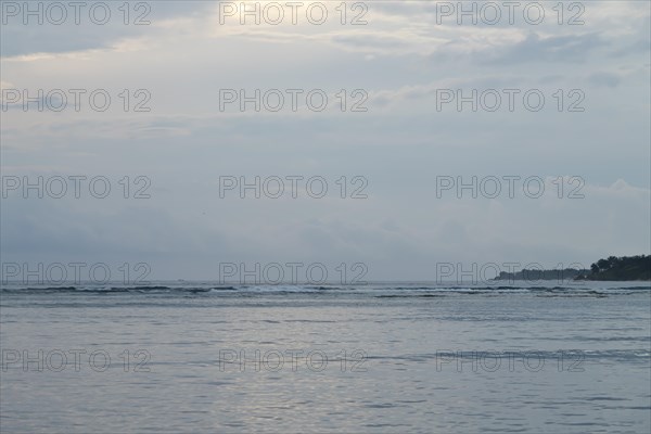 Lombok and Gili Air islands, overcast, cloudy day, sky and sea. Vacation, travel, tropics concept, no people. Sunset, sand beach