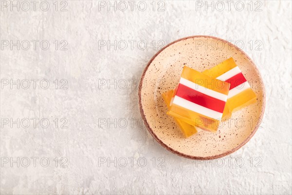 Almond milk and peach jelly on gray concrete background. top view, flat lay, copy space