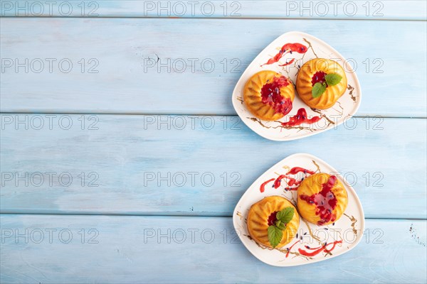 Semolina cheesecake with strawberry jam, lavender, on blue wooden background. top view, flat lay, copy space