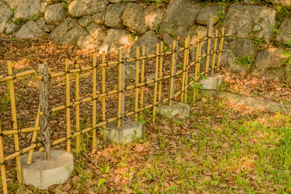 Fence of PVC pipes that resembles bamboo in Hiroshima, Japan, Asia