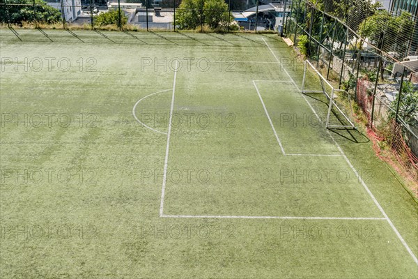 Soccer goal at end of green field in urban park in Istanbul, Tuerkiye