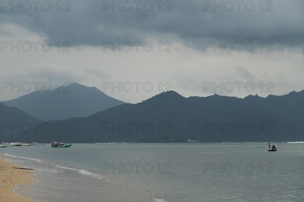 Lombok and Gili Air islands, overcast, cloudy day, sky and sea. Vacation, travel, tropics concept, no people. Sunset, sand beach