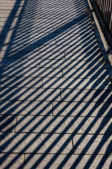 Shadow of a Railing on the Street in Campione d'Italia, Lombardy, Italy, Europe