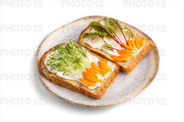 White bread sandwiches with cream cheese, calendula petals and microgreen isolated on white background. side view, close up