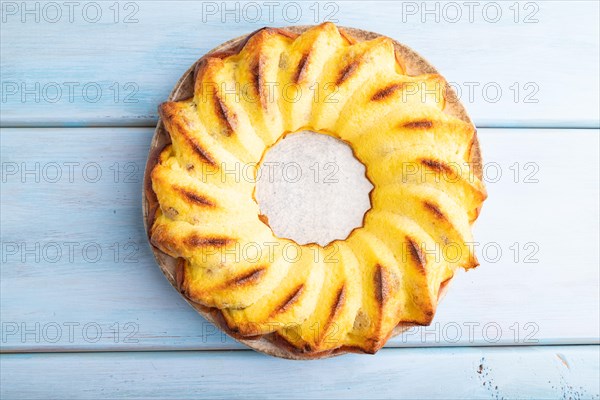 Cheesecake on blue wooden background. top view, flat lay, close up