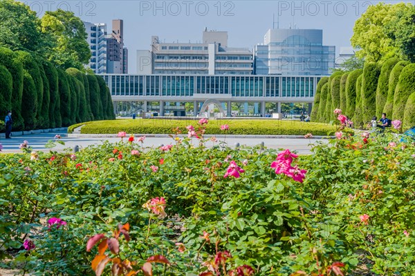 Landscape of Peace Memorial Park with city buildings in background in Hiroshima, Japan, Asia