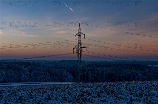 Electricity pylon at dusk near Fueramoos, Baden-Wuerttemberg, Germany, Europe