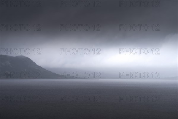 Uncomfortable atmosphere at lake Soenstevatn, landscape format, light mood, thunderstorm, rain, Uvdal, Viken, Norway, Europe