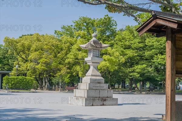 Large stone carved lantern in plaza at Peace Memorial Park in Hiroshima, Japan, Asia