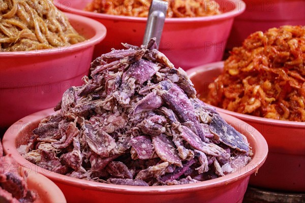 Fermented salted squids and shrimps displayed and sold at the local Samaki Market showing the authentic culture and cuisine in Kampot, Cambodia, Asia