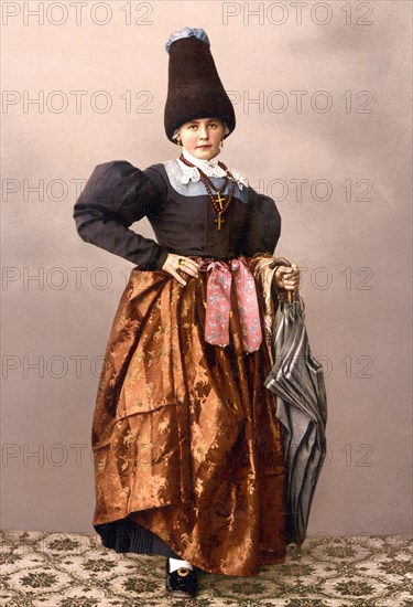 Val Gardena, Woman in typical traditional costume, Tyrol, former Austro-Hungary, now South tyrol, Italy, c. 1890, Historic, digitally restored reproduction from a 19th century original Val Gardena, Woman in typical costume, Tyrol, former Austro-Hungary, now South tyrol, Italy, 1890, Historic, digitally restored reproduction from a 19th century original, Europe