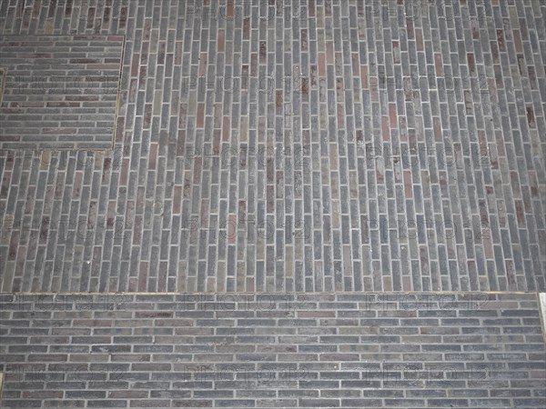 Dark brown brick wall background