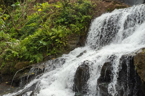 Uma Anyar waterfall, Bali island, Ubud, Indonesia. Jungle, tropical forest, daytime with cloudy sky