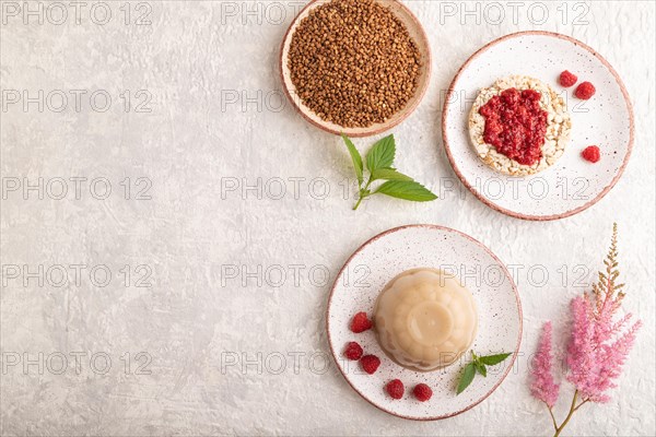 Buckwheat milk jelly on gray concrete background. top view, flat lay, copy space