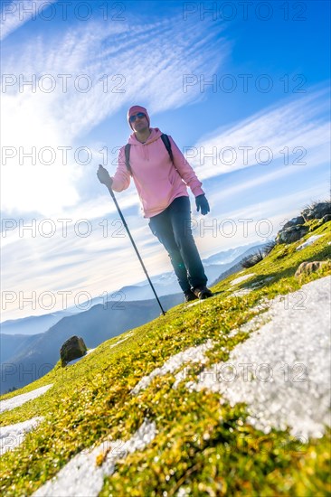 A man walking along the snowy peak of Mount Adarra, municipality of Urnieta in Gipuzkoa. Basque Country