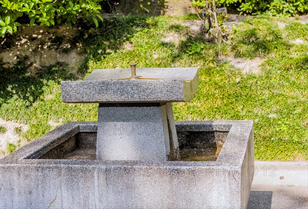 Dry concrete water fountain in urban park in Hiroshima, Japan, Asia