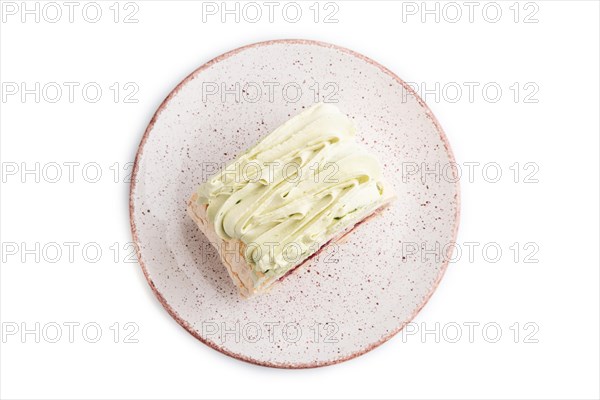 Roll biscuit cake with cream cheese and jam isolated on white background, top view, flat lay, close up