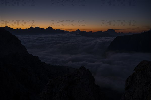 Sunrise over a sea of fog and Dolomite peaks in the background, Corvara, Dolomites, Italy, Europe