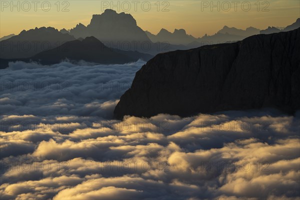 Sunrise over a sea of fog and Dolomite peaks in the background, Corvara, Dolomites, Italy, Europe