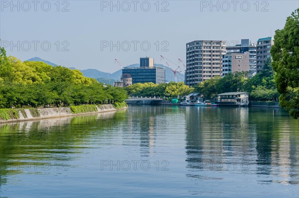 Canal through tree lined park in Hiroshima, Japan, Asia