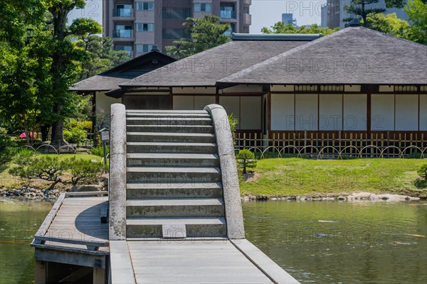 Concrete bridge across lake at Shukkeien Gardens in Hiroshima, Japan, Asia