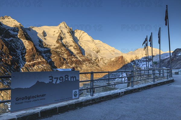 Viewing platform in front of a mountain peak in the morning light, autumn, Kaiser Franz Josefs Hoehe, Grossglockner in the background, Hohe Tauern National Park, Carinthia, Austria, Europe