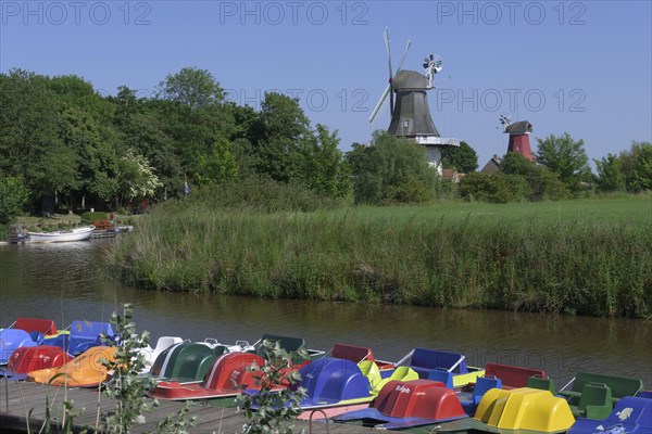 Twin mills in Krummhoern-Greetsiel with boat hire, Gruene Muehle, Rote Muehle, Germany, Europe