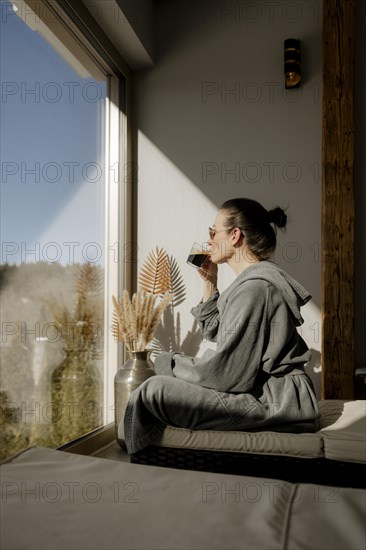 Woman enjoying coffee at a wellness centre