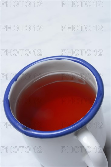 Red fruit tea in mug, tea