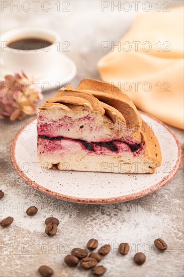 Zephyr or marshmallow cake with cup of coffee on brown concrete background and orange textile. side view, close up, selective focus