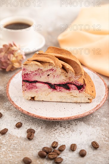 Zephyr or marshmallow cake with cup of coffee on brown concrete background and orange textile. side view, close up, selective focus