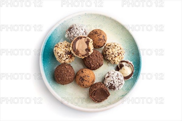Chocolate truffle candies isolated on white background. top view, flat lay, close up