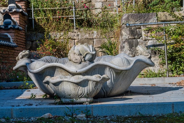 Stone carved lotus flower water basin at Buddhist temple in Korea in Gimje-si, South Korea, Asia