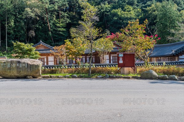 Buildings used for temple stay residents at Geumsansa Temple with lush green trees in background in Gimje-si, South Korea, Asia