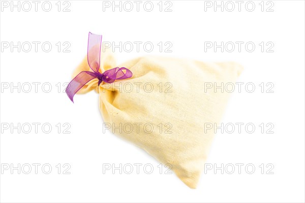 Yellow textile pouch isolated on white background. Top view, flat lay, close up