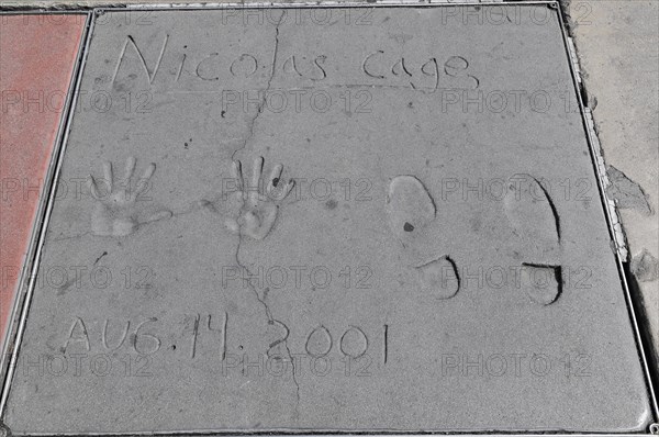Handprints and footprints of Nicolas Cage, Hollywood Boulevard, Los Angeles, California, USA, North America